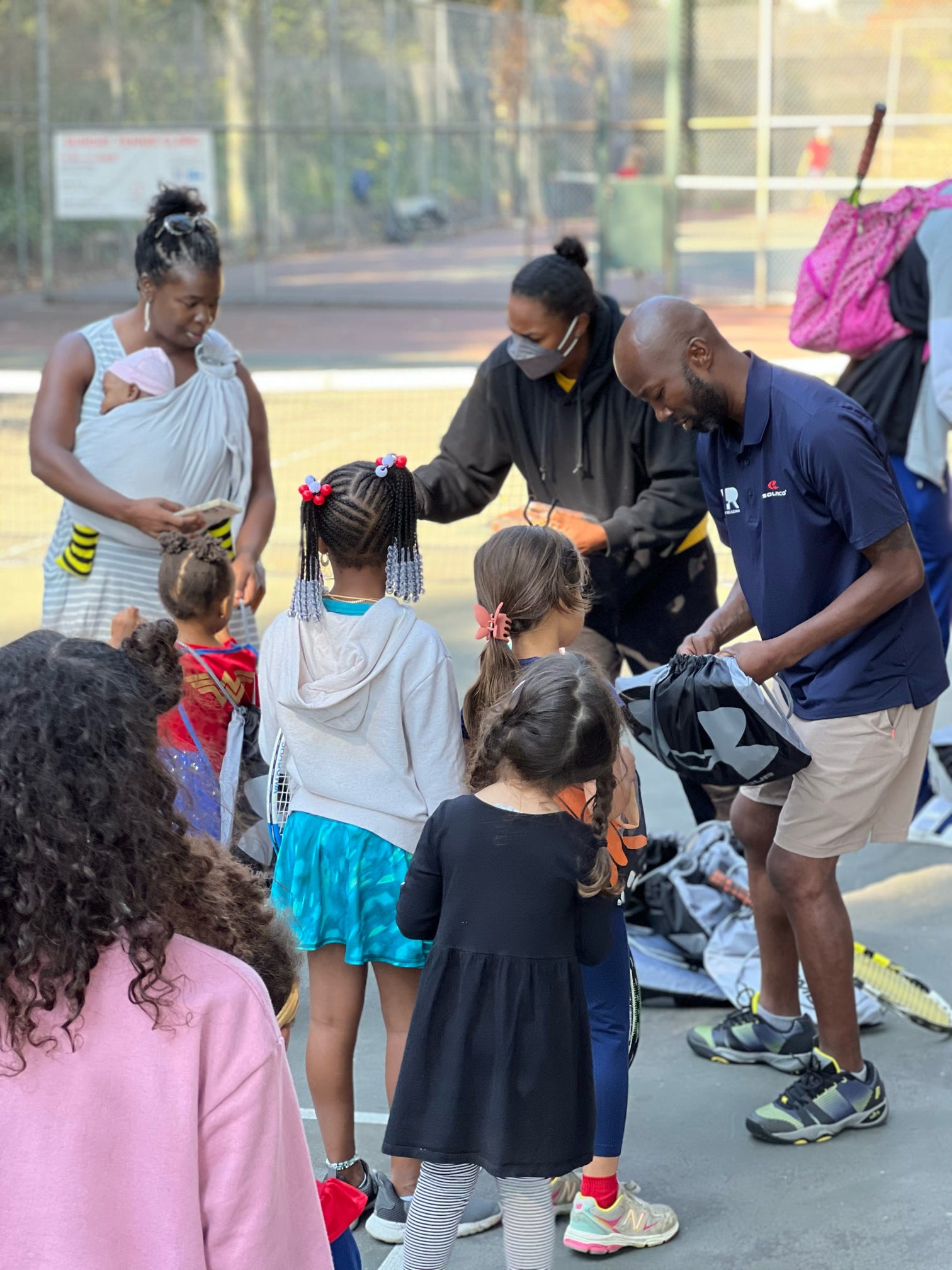 WELO youth and adults gathered outdoors